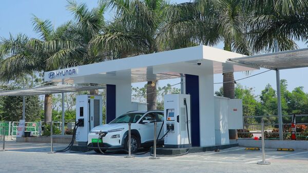 A Hyundai Kona Electric being charged on the Hyderabad-Vijayawada highway.