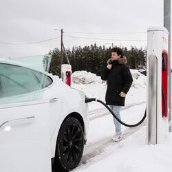 Tesla owner Philip Benassi is seen at a charging station in Jessheim, southeast Norway. He has experienced range anxiety on cold winter days, but like other Norwegians, he's learned to cope.