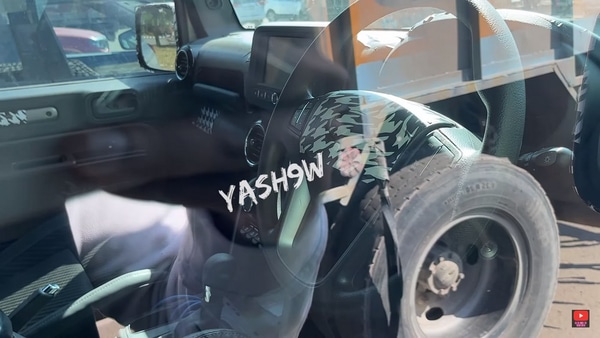 The centre console misses out on a 4x4 lever. It is replaced with a cubby space. (Photo courtesy: YouTube/Yash9w) The centre console misses out on a 4x4 lever. It is replaced with a cubby space. (Photo courtesy: YouTube/Yash9w)