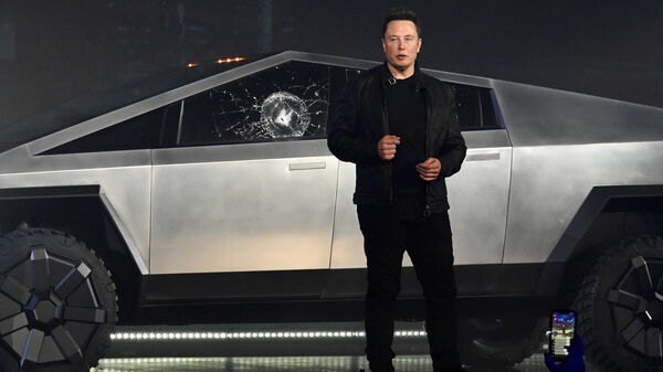 A file photo of Tesla CEO Elon Musk unveiling the Cybertruck three years ago in California. Despite several deadlines and record bookings, the electric pickup truck has yet to enter production.  (Reuters)