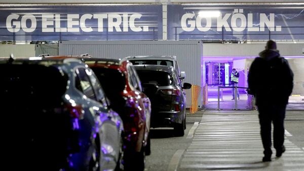 FILE PHOTO: A Ford Motor Company employee goes to work at the company's factory in Cologne.  (Reuters)