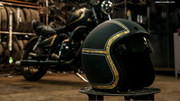 Eimor Customs has elegantly modified a Royal Enfield Classic 350.  The store also made a custom open-face helmet. 