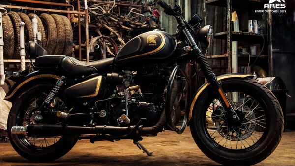 The motorcycle is painted matte black with gold painted stripes.  The engine is also blacked out. 