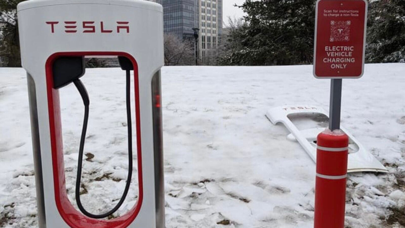 Tesla begins adding ‘magic dock’ that lets other brands’ EVs use its chargers