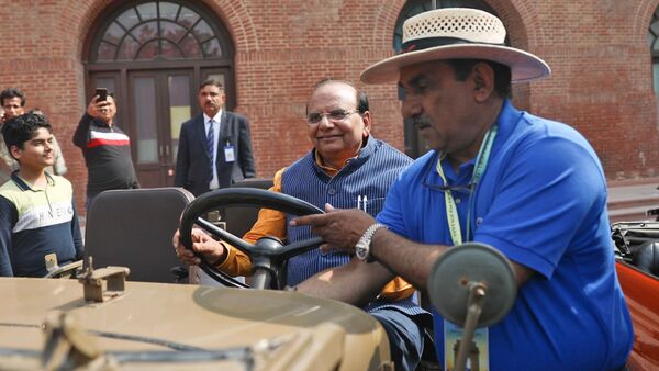 Delhi Lieutenant Governor VK Saxena rides a vintage car during a Vintage car drive organized by Heritage Motoring Club of India, in New Delhi on Sunday. (Ayush Chopra/ANI)
