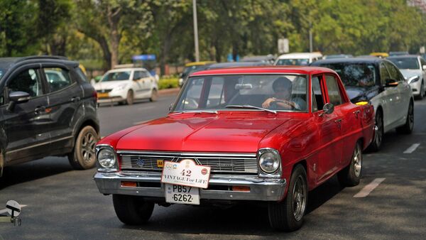 Vintage cars are seen on the road taking part in a vintage car race organized by the Heritage Motor Club of India in New Delhi on Sunday.