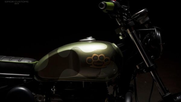 The stock instrument cluster has been replaced with an after-market unit. There is also a custom leg guard that goes with the design of the motorcycle. The stock instrument cluster has been replaced with an after-market unit. There is also a custom leg guard that goes with the design of the motorcycle.