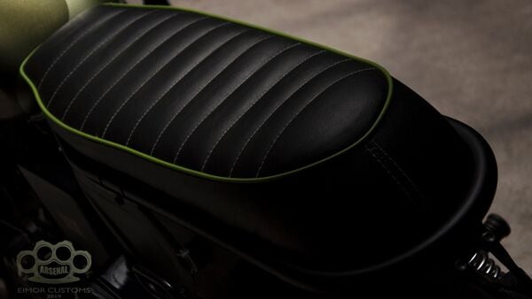 The stock seat has been removed and replaced with a slim single piece unit that gets green stitching. The stock seat has been removed and replaced with a slim single piece unit that gets green stitching.