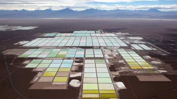 Aerial view showing the brine pools and processing area of ​​the Soquimich (SQM) lithium mine on the Atacama Salt Flats in the Atacama Desert of northern Chile,