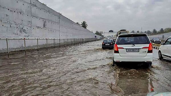 The Bengaluru-Mysuru Expressway was flooded, forcing commuters to wade across, leading to traffic jams.
