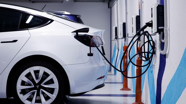 A file photo of an electric car plugged in for charging.  (Reuters)