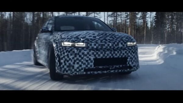 Hyundai Ioniq 5 N teaser shows a camouflaged test mule driving sideways on a Swedish snow-covered track