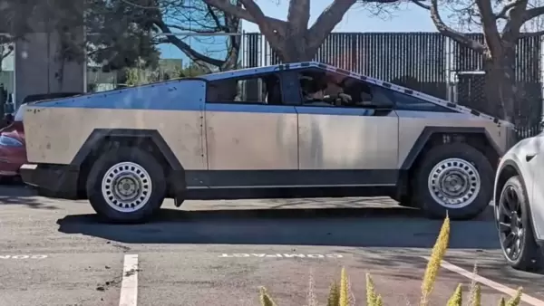 A Tesla Cybertruck test mule was recently spotted near the electric car maker's Fremont factory, complete with different rims and several wires attached to the body.  (Image: Cybertruck Owners Club)