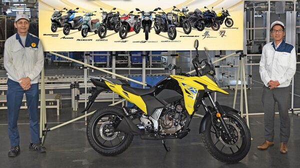 The celebratory unit is a Suzuki V-Storm SX motorcycle in the Champion Yellow No. 2 color scheme. 