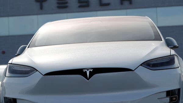 Tesla shares fell sharply after the electric carmaker reported lower profits as a result of continued price cuts on its models.  (Associated Press)