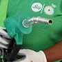 File photo: An attendant holds a fuel nozzle at a Jio-bp petrol station. (REUTERS)