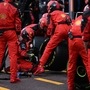 Crew work on the car of Ferrari driver Charles Leclerc of Monaco during the Monaco Formula One race. (AP)