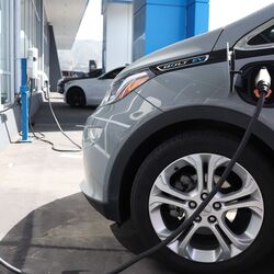 A Chevrolet Bolt EV sits parked at a charging station at Stewart Chevrolet.