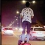 This person, identified as an 18-year old boy from Ahmedabad, was caught performing stunt by standing on his moving Honda Activa scooter in the city on a busy road.