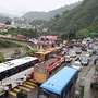 Vehicles stuck in a traffic jam as the Chandigarh-Manali national highway got blocked following landslides triggered by rainfall, in Mandi on Monday. (Jai Kumar)