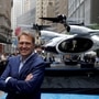 Joby Aviation founder JoeBen Bevirt poses next to a Joby Aviation Air Taxi in Manhattan, New York City.  (REUTERS)