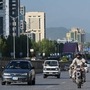 File photo of motorists commuting in morning hours in Islamabad. (AFP)