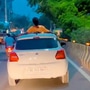 Watch: Man performs stunt on moving car's roof in Noida, slapped with ₹26k fine