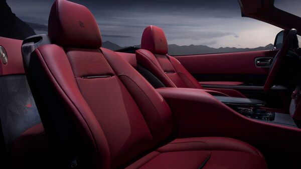 More than 1,600 wood pieces have been hand-finished and hand-placed over a two-year period inside the cabin of the Rolls-Royce La Rose Noire Droptail. There is an Audemars Piguet Royal Oak Concept timepiece integrated into the dashboard. More than 1,600 wood pieces have been hand-finished and hand-placed over a two-year period inside the cabin of the Rolls-Royce La Rose Noire Droptail. There is an Audemars Piguet Royal Oak Concept timepiece integrated into the dashboard.