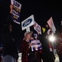 Members of the UAW (United Auto Workers) picket and hold signs outside of the UAW Local 900 headquarters across the street from the Ford Assembly Plant in Wayne, Michigan. (AFP)