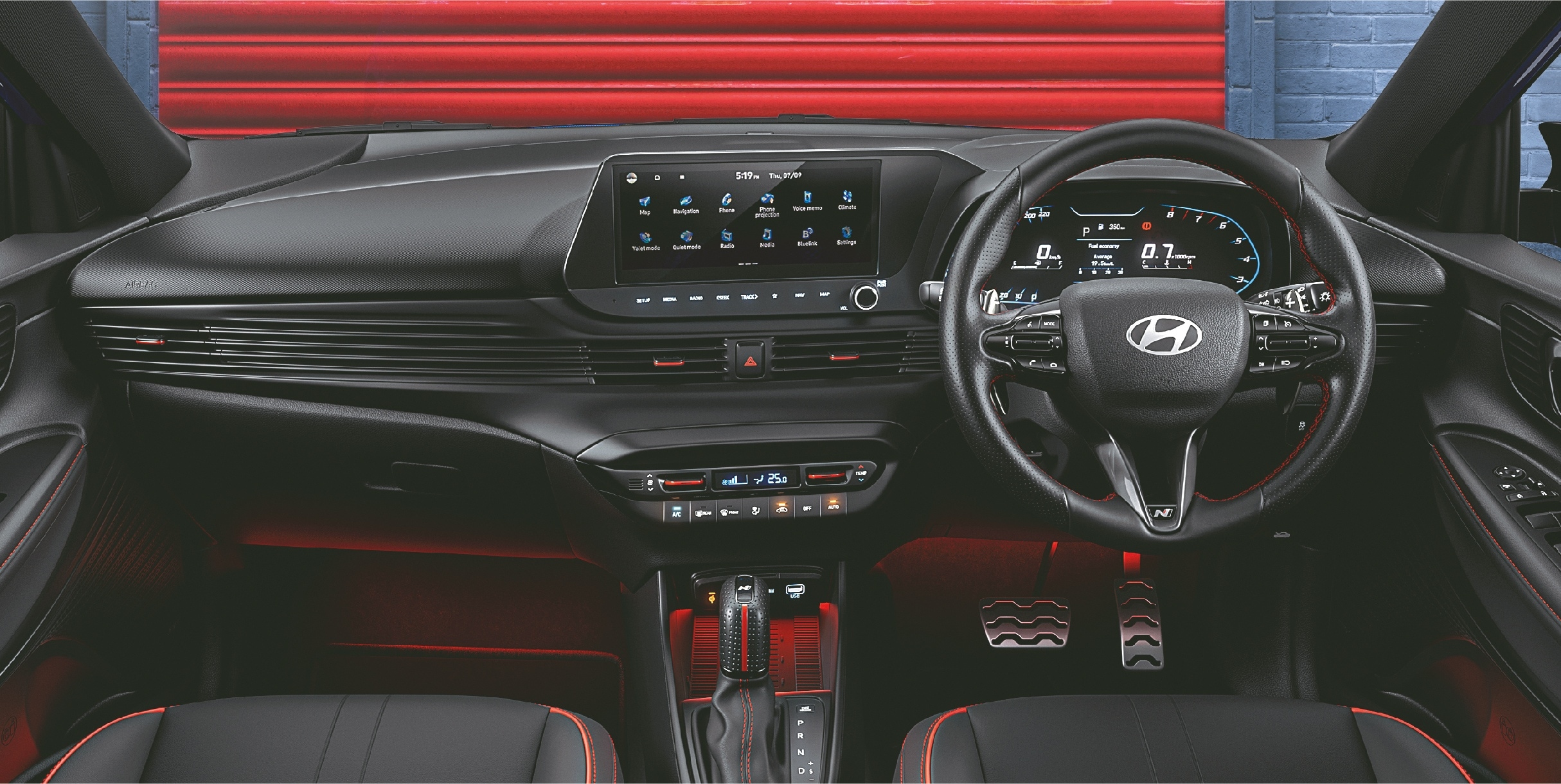 The cabin gets an all-black interior with red inserts, leather upholstery and red ambient lighting