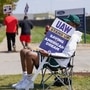 A striking UAW member pickets outside the Ford Michigan Assembly Plant in Wayne, Michigan, United States. (REUTERS)