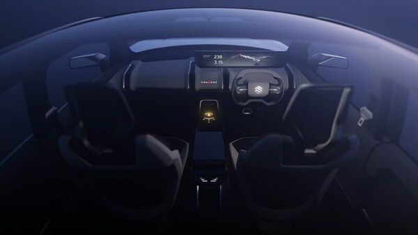 The entire cabin of the eVX is simplistic with dual-tone theme that also reflects on the sporty seats. The AC vents on the dashboard are vertically aligned. In the middle of the centre console lies the round rotary gearbox knob which can will be used to select drive and parking modes.(Image courtesy: CarWatch) The entire cabin of the eVX is simplistic with dual-tone theme that also reflects on the sporty seats. The AC vents on the dashboard are vertically aligned. In the middle of the centre console lies the round rotary gearbox knob which can will be used to select drive and parking modes.(Image courtesy: CarWatch)