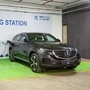 A Mercedes EQC electric SUV charges at a Tata Power EZ EV charging station.