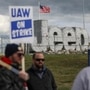 Strikers stand in front of the Jeep sign during another day of UAW strikes at the Jeep Assembly Plant in Toledo, Ohio. (AP)