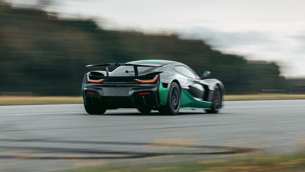 The Rimac Nevera has a top speed of around 401 kmph. But that is when going in the forward direction. The supercar has several records to its name but driving at high speeds in reverse may have been a massive challenge. The company says that simulations showed speeds of around 240 kmph were possible in reverse. In the real-world test, the supercar fared even better. The Rimac Nevera has a top speed of around 401 kmph. But that is when going in the forward direction. The supercar has several records to its name but driving at high speeds in reverse may have been a massive challenge. The company says that simulations showed speeds of around 240 kmph were possible in reverse. In the real-world test, the supercar fared even better.