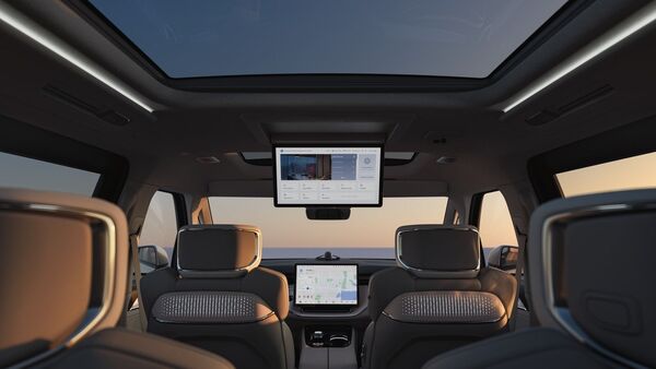 The interior of the Volvo EM90 electric minivan oozes with luxury with features like hanging entertainment screen for rear passengers and a massive panoramic sunroof. Volvo EM90 interior