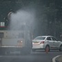 An anti smog truck is seen sprinkling water to settle down dust particles at India Gate Circle in New Delhi. (Raj K Raj/ Hindustan Times)
