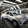 File photo of an assembly line worker inspecting a 2023 Chevrolet Bolt at the General Motors' Orion Assembly in Lake Orion, Michigan. GM became the first Detroit automaker to get a ratified deal that could end a contentious labor dispute and a series of punishing strikes. (AP)