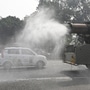 An anti-smog gun sprinkles water in India Gate circle to curb the rising air pollution in New Delhi on Thursday, November 23. The national capital could see GRAP stage four which will ban plying of BS3 petrol and BS4 diesel cars. (Hindustan Times)