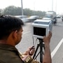 Noida Traffic police issuing challan for over speeding vehicles on Parthala Signature Bridge in sector 122. (Photo by Sunil Ghosh / Hindustan Times) 