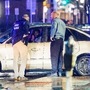 Members of the United States Secret Service speak to the driver of the vehicle that crashed into a Secret Service SUV that was blocking the street as US President Joe Biden exited his campaign headquarters, in Wilmington, Delaware. (REUTERS)
