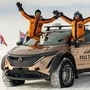 Chris and Julie Ramsey in their modified Nissan Ariya EV at the South Pole.