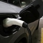 File photo: A charging handle recharges a Volkswagen ID.4 electric vehicle (EV) parked at an EV charging station inside a parking garage owned by the City of Baltimore in Maryland. (REUTERS)