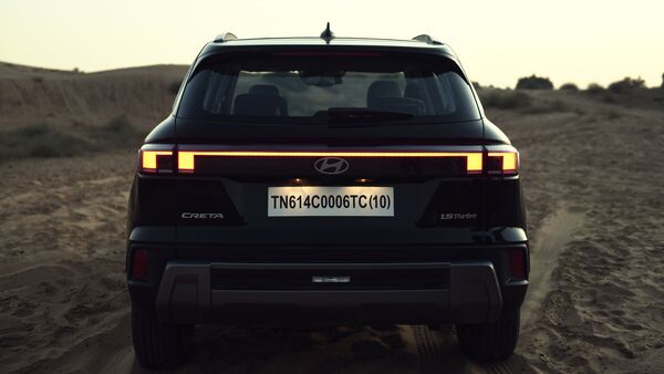 Moving to the rear profile, the SUV sports a revamped look as well. The sculpted tailgate features a sleek LED bar connecting the boxy looking LED taillights. This is a design philosophy almost every modern car is adopting and new Hyundai Creta is no different than them. The LED strip runs through the centre of the tailgate, while other design updates at the rear include a roof spoiler, updated beefy bumper with skid plate etc. Moving to the rear profile, the SUV sports a revamped look as well. The sculpted tailgate features a sleek LED bar connecting the boxy looking LED taillights. This is a design philosophy almost every modern car is adopting and new Hyundai Creta is no different than them. The LED strip runs through the centre of the tailgate, while other design updates at the rear include a roof spoiler, updated beefy bumper with skid plate etc.