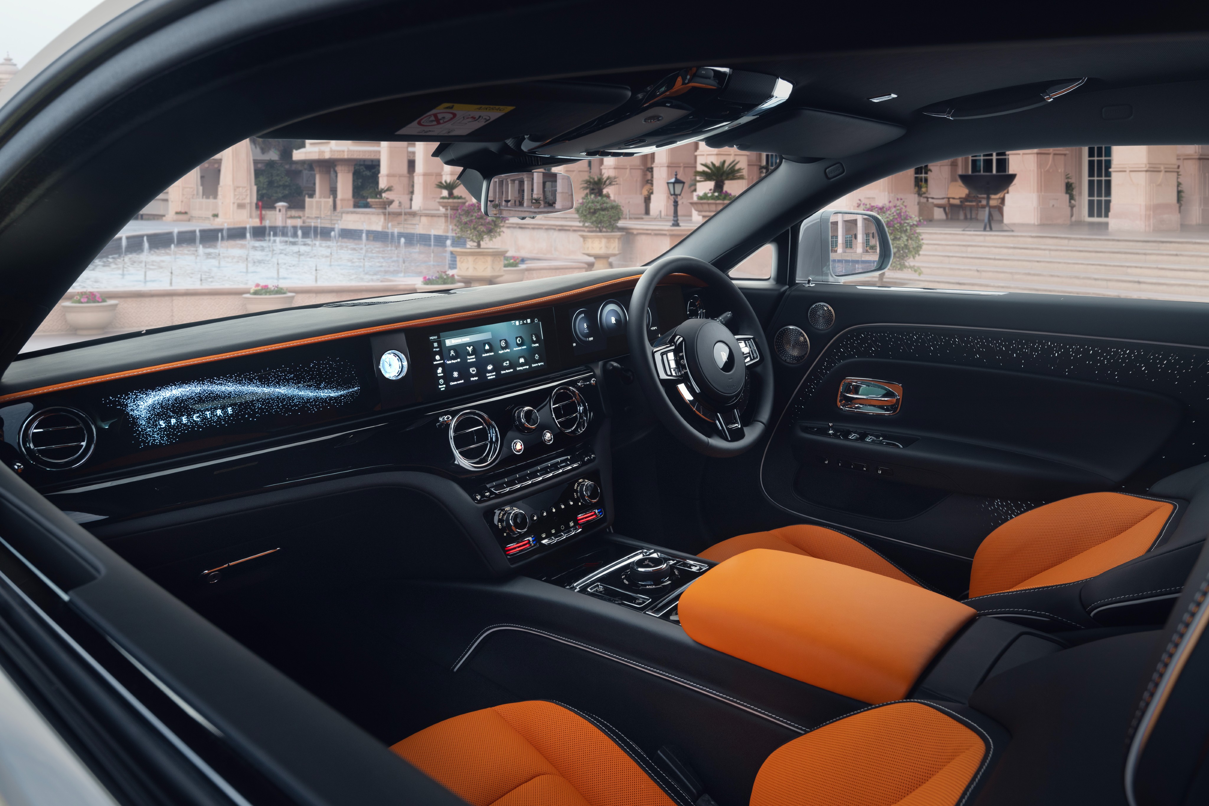 The Spectre nameplate on the dashboard is illuminated using a cluster of over 5,500 star-like illuminations Rolls-Royce Spectre