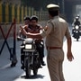 Noida Police checking people violating traffic rules during Holi. More than 8,000 motorists were caught riding without helmet during the festival. (Photo by Sunil Ghosh / Hindustan Times) 