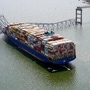 An aerial image of the cargo ship Dali stuck under part of the structure of the Francis Scott Key Bridge in Baltimore, United States after the ship crashed into it. (AP)