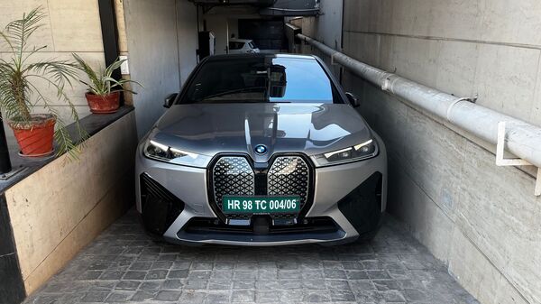 Owing to the sheer size of the EV, fitting it into some of the tighter public-charging points may be an arduous task. Here, notice the charger on the left-back of the vehicle.