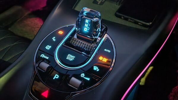 The centre console offers plenty of charging options, including two wireless charging pads that can be used simultaneously. There are more charging ports placed under the centre console. The biggest attraction though is the cluster of buttons along with gear shifter placed at the centre. It houses the start-stop button, climate control, drive modes, traction control and more.