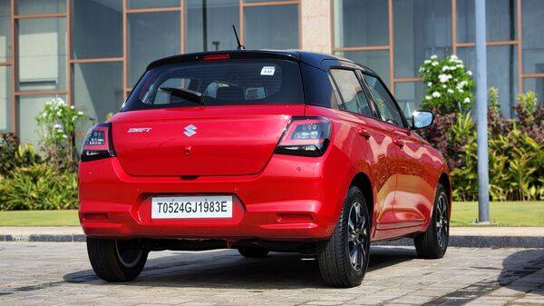 Although largely similar to the previous version, the rear of the 2024 Swift looks sportier because of the updated tail lights here. Maruti Suzuki Swift